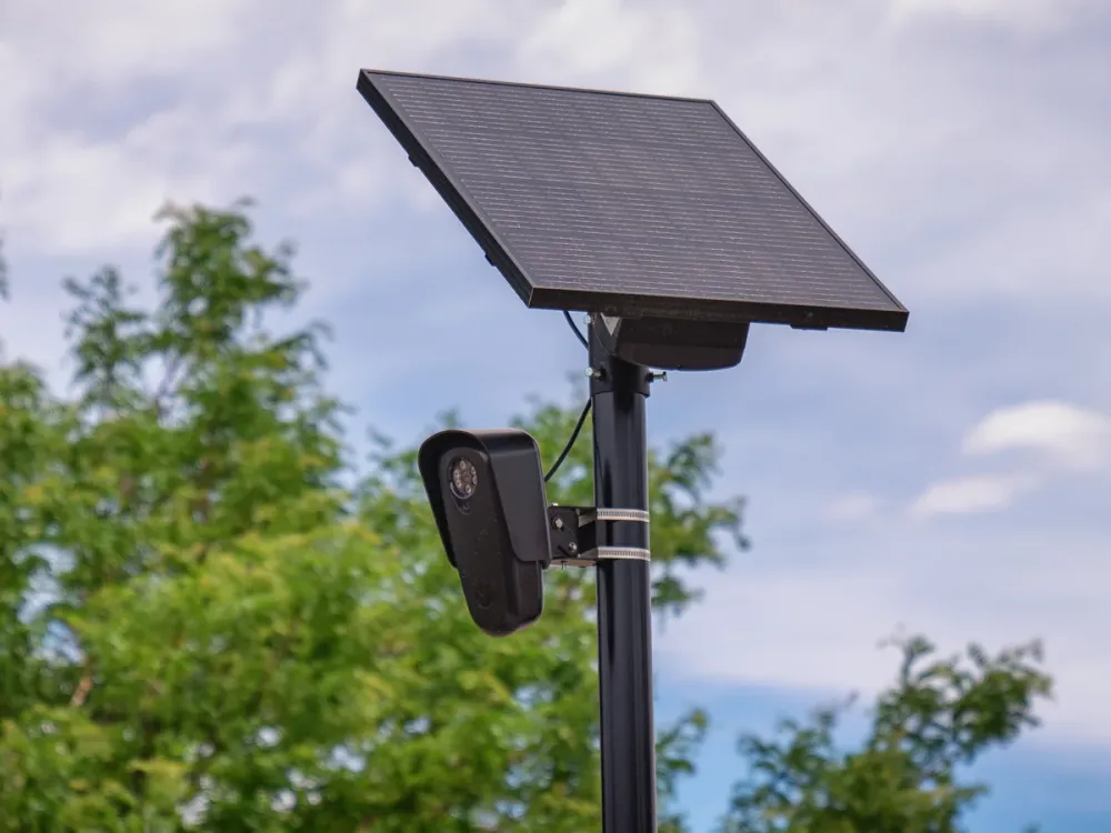 A real Flock Safety automated license-plate reader mounted on a roadside pole.